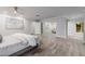 Spacious main bedroom boasts wood-look floors, closet doors, and modern decor at 26 W Morten Ave, Phoenix, AZ 85021