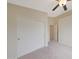 Bedroom featuring neutral carpet, ceiling fan, and sliding door closet at 2627 E Gary Way, Phoenix, AZ 85042