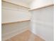 Walk-in closet with carpet floors and shelf and bar storage at 2627 E Gary Way, Phoenix, AZ 85042