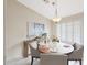 Stylish dining area with seating for four, complemented by a modern light fixture at 2627 E Gary Way, Phoenix, AZ 85042
