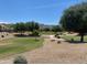 Serene golf course view with lush greenery, mature trees and mountains in background at 2627 E Gary Way, Phoenix, AZ 85042