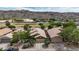 A landscaped single-Gathering home in a community featuring desert landscaping, mature trees, and tile roofs at 2627 E Gary Way, Phoenix, AZ 85042