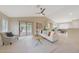 Bright living room with sliding doors leading to a pool, creating an indoor-outdoor flow at 2627 E Gary Way, Phoenix, AZ 85042