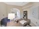 Cozy home office featuring a wooden desk, stylish decor, and comfortable seating area at 2627 E Gary Way, Phoenix, AZ 85042