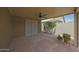 Covered back patio with stone floors and ceiling fan at 2627 E Gary Way, Phoenix, AZ 85042