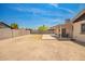 Large backyard with a covered patio and block fencing around the property at 2826 E Cactus Rd, Phoenix, AZ 85032