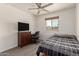 Bedroom with a desk setup, modern flooring, and a large window with neighborhood views at 2826 E Cactus Rd, Phoenix, AZ 85032