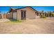 Side view of home exterior showcasing modern trim and a two-car garage at 2826 E Cactus Rd, Phoenix, AZ 85032