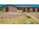 Cozy single-story home with stucco exterior and decorative stone accents around the windows and front door at 2826 E Cactus Rd, Phoenix, AZ 85032