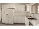 Bright kitchen with white cabinets, marble countertops, and stainless steel appliances at 2826 E Cactus Rd, Phoenix, AZ 85032