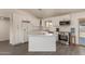 Modern kitchen with white cabinets, stainless steel appliances, a center island, and backyard views at 2826 E Cactus Rd, Phoenix, AZ 85032