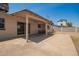 Covered patio area with outdoor seating overlooking the backyard at 2826 E Cactus Rd, Phoenix, AZ 85032