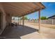 Covered patio area with outdoor seating overlooking the backyard at 2826 E Cactus Rd, Phoenix, AZ 85032