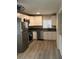 Bright kitchen featuring stainless steel appliances and ample cabinet space at 286 W Palomino Dr # 105, Chandler, AZ 85225