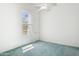 Empty bedroom features a window and blue carpet at 316 E Bethany Home Rd, Phoenix, AZ 85012