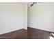 Bedroom featuring hardwood flooring and a large walk-in closet at 316 E Bethany Home Rd, Phoenix, AZ 85012