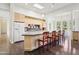 Spacious open kitchen with seating at the bar and stainless appliances plus a skylight at 316 E Bethany Home Rd, Phoenix, AZ 85012