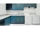 Laundry room features washer, dryer and ample counter space at 316 E Bethany Home Rd, Phoenix, AZ 85012