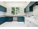Spacious laundry room with custom cabinets and a large window at 316 E Bethany Home Rd, Phoenix, AZ 85012