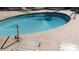 A serene swimming pool with clear blue water surrounded by sun loungers and a deck at 3301 E Earll Dr # 219, Phoenix, AZ 85018