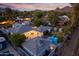 Expansive property featuring a pool, outdoor dining area, and lush green landscaping at 3429 E Coolidge St, Phoenix, AZ 85018