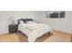 Comfortable bedroom with hardwood floors, window, gray nightstand, and neutral decor at 3429 E Coolidge St, Phoenix, AZ 85018