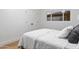 Comfortable bedroom with plush pillows, hardwood floors, window, and a closet at 3429 E Coolidge St, Phoenix, AZ 85018
