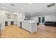 Bright kitchen features a large island with a quartz countertop and modern appliances at 3429 E Coolidge St, Phoenix, AZ 85018