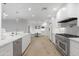 Gourmet kitchen has stainless steel appliances, white cabinets, and a breakfast nook at 3429 E Coolidge St, Phoenix, AZ 85018