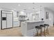 Contemporary kitchen features stainless steel appliances and a large island with seating at 3429 E Coolidge St, Phoenix, AZ 85018