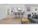 Modern living area with a kitchen, bar stools, and a comfortable gray sofa at 3429 E Coolidge St, Phoenix, AZ 85018