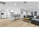 Open-concept living area connects to the kitchen with bar seating and modern decor at 3429 E Coolidge St, Phoenix, AZ 85018