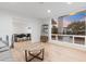 Bright living room features wood floors and large windows with sunset views at 3429 E Coolidge St, Phoenix, AZ 85018