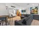 Inviting living area featuring a comfortable sofa, a stylish kitchen, and a cozy sleeping space at 3429 E Coolidge St, Phoenix, AZ 85018
