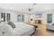 Bright main bedroom with hardwood floors, ceiling fan, and access to the backyard at 3429 E Coolidge St, Phoenix, AZ 85018