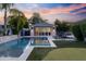 Tranquil pool area with sun loungers and a well-maintained backyard, ideal for relaxation and outdoor enjoyment at 3429 E Coolidge St, Phoenix, AZ 85018