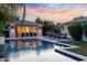 Inviting pool and spa area, surrounded by lush landscaping and perfect for outdoor entertaining at 3429 E Coolidge St, Phoenix, AZ 85018