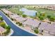 Aerial view of home near lake and golf course offering scenic community views at 36047 N Copper Hollow Way, Queen Creek, AZ 85140