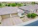 Aerial view of home with tile roof, desert landscaping, and a well-manicured front yard at 36047 N Copper Hollow Way, Queen Creek, AZ 85140