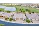 Aerial view displays the home's proximity to golf course and lake amenities at 36047 N Copper Hollow Way, Queen Creek, AZ 85140