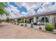 Beautiful backyard with multiple patios, desert landscaping, and scenic views at 36047 N Copper Hollow Way, Queen Creek, AZ 85140