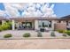 Picturesque backyard featuring a covered patio and desert-style landscaping at 36047 N Copper Hollow Way, Queen Creek, AZ 85140
