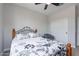 Bedroom with a ceiling fan, comfortable seating area, and closet with sliding doors at 36047 N Copper Hollow Way, Queen Creek, AZ 85140
