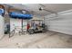 Spacious garage with golf cart, bicycle, and overhead storage racks at 36047 N Copper Hollow Way, Queen Creek, AZ 85140