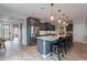 Beautiful kitchen featuring granite countertops, stainless steel appliances and kitchen island with seating at 36047 N Copper Hollow Way, Queen Creek, AZ 85140