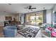 Inviting living room with stylish furnishings and large sliding doors to backyard at 36047 N Copper Hollow Way, Queen Creek, AZ 85140