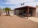 Private backyard features a covered patio, seating, a pool and mature trees for shade at 3726 W Campo Bello Dr, Glendale, AZ 85308