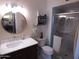 Bathroom featuring a vanity with marble top, mirror, and glass-enclosed shower at 3726 W Campo Bello Dr, Glendale, AZ 85308