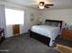 Comfortable bedroom with a queen-sized bed, plush carpet, and ample natural light at 3726 W Campo Bello Dr, Glendale, AZ 85308
