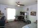 Bedroom with bright window, desk, ceiling fan, and decor at 3726 W Campo Bello Dr, Glendale, AZ 85308
